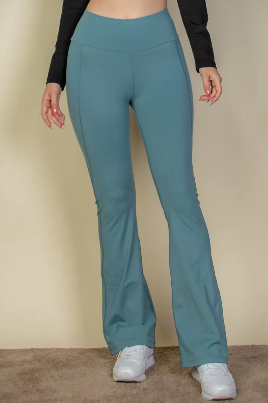 Flare leg pants with a wide waistband. Relaxed Fit Trousers